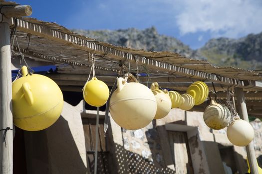 Fishing floats hanging on porch