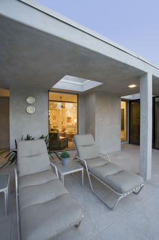 Deckchairs outside modern residence