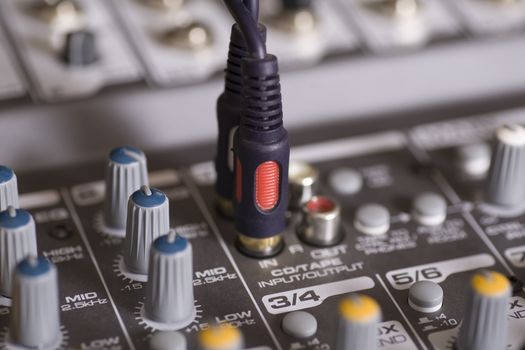 Mixing console with wires plugged in