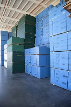 Blue boxes piled up of in warehouse