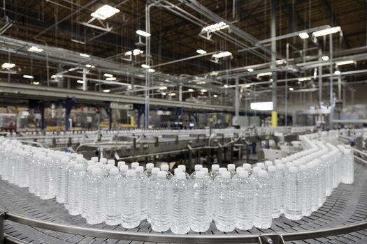 Bottled water on conveyor at bottling plant