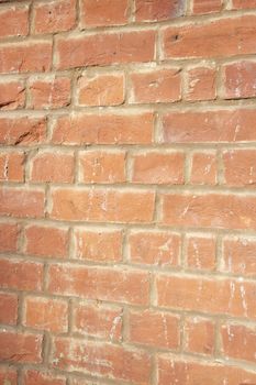 Close-up of reddish-brown brick wall
