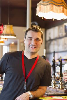 Portrait of smiling pub manager