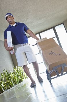 Happy African American delivery man