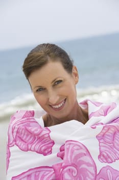 Woman wrapped in beach towel