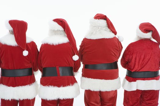 Group of men dressed as Santa Claus rear view