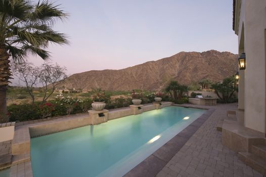 Paved poolside area of Palm Springs home