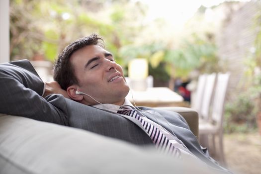 Businessman relaxing at home