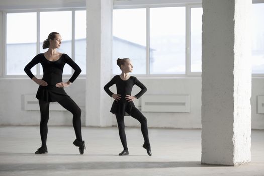 Female dancers with hands on hips