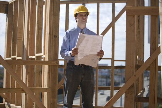 Site manager with building plans