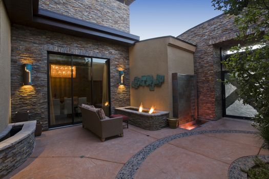 Exterior with patio furniture and lights