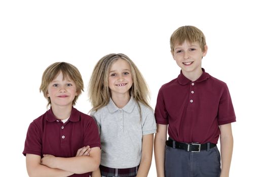 Portrait of happy school children in uniform over white background