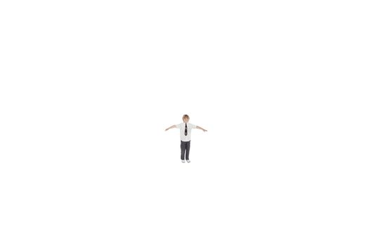 Elementary boy standing at distance with arms outstretched over white background