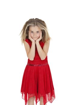 Portrait of girl in red frock with head in hands over white background