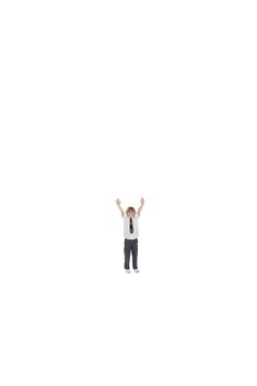 Elementary boy standing at distance with arms raised over white background