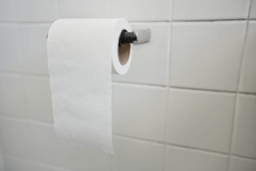 Close-up of tissue paper roll in bathroom