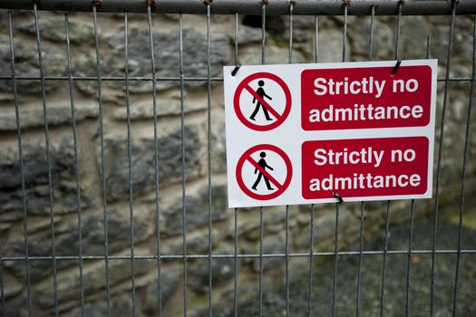 Strictly No Admittance sign on fence