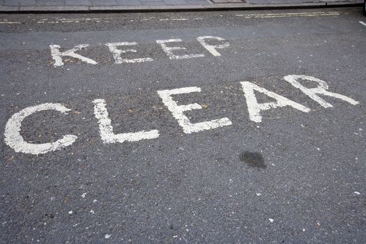 Close-Up of road marking saying Keep Clear in London, UK