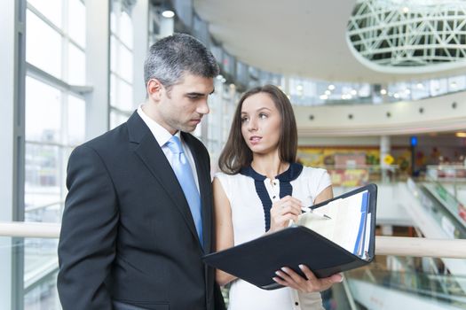 Businessman and woman discussing work
