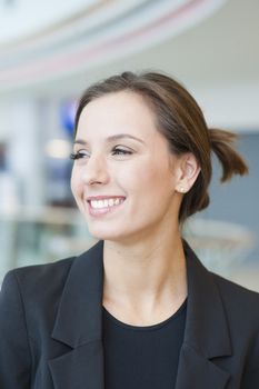 Smiling businesswoman looking off camera