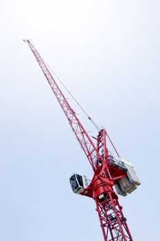 Close-up view of a red crane against sky