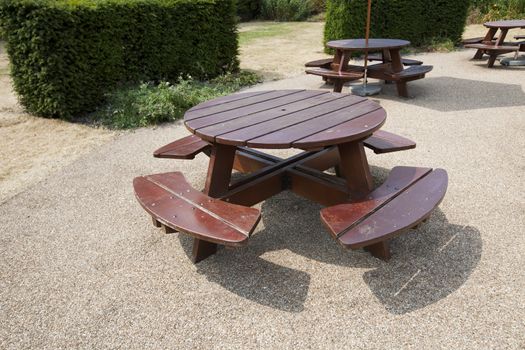 Wooden picnic tables in park