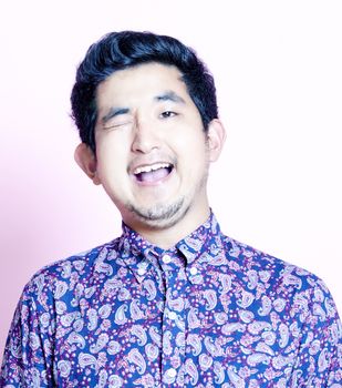 Young Geeky Asian Man in colorful shirt 