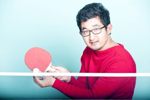 Asian man playing table tennis 