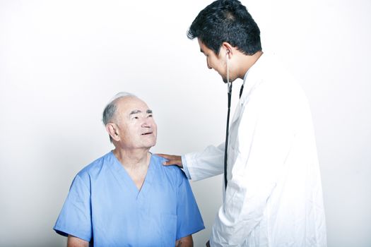 A young Asian Doctor comforting a Senior adult patient