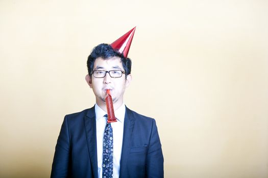 Asian business man wearing party hat
