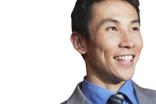 Asian mid-adult businessman smiling against white background