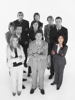 Portrait of confident business team standing with arms crossed against white background