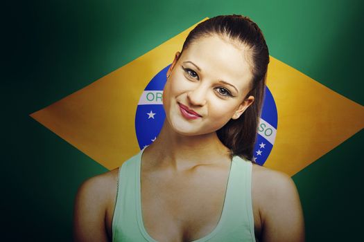 Beautiful Young woman smiling standing in front of Brazilian flag