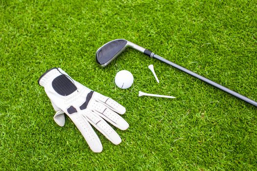 Golf equipment on green grass