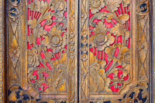 Indian inspired carved golden red wooden door