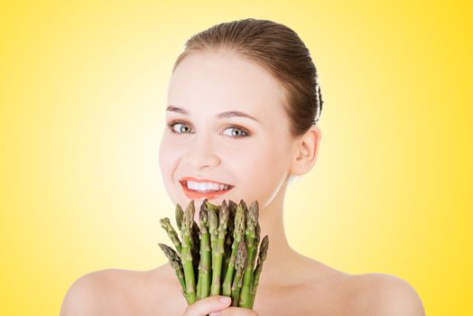 Beautiful fit woman with asparagus
