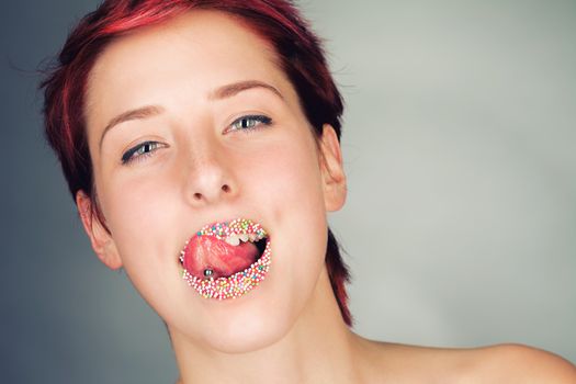 woman licking her colorful sugar lips