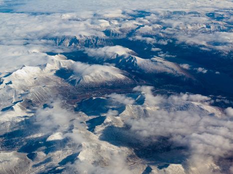 Aerial view of snowcapped mountains in northern part of the province of beautiful British Columbia, Canada.