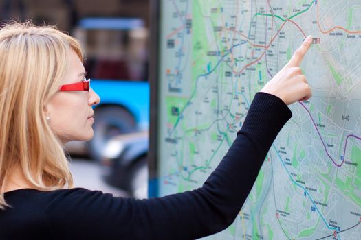 Woman looking on the metro map board
