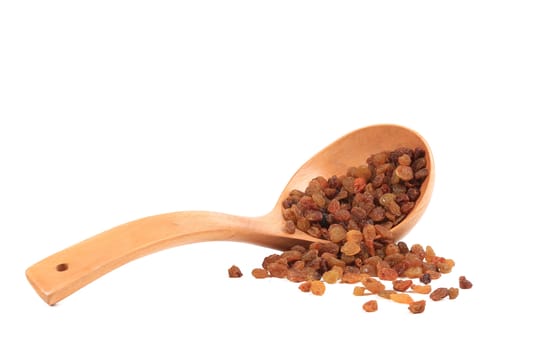 Wooden spoon with raisins.
