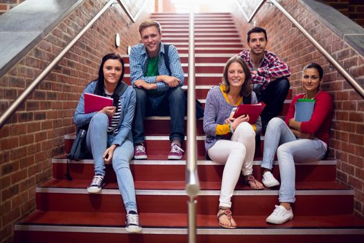 College students sitting on stairs in the college