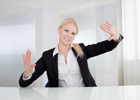 Business woman touching the screen with her finger
