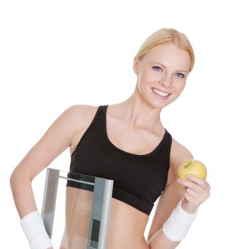 Fitness woman with weights and apple