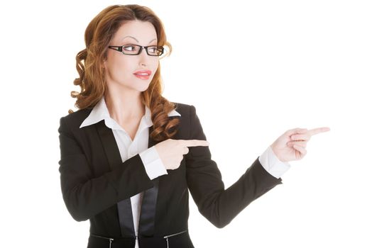 Happy success businesswoman pointing