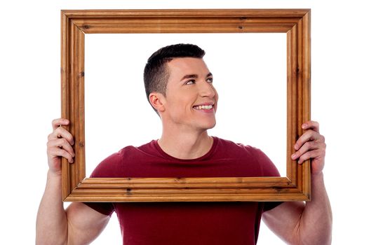 Man holding wooden picture frame