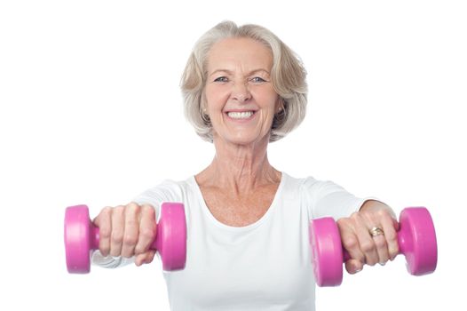 Happy aged woman exercising