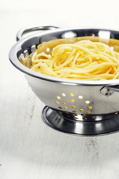 spaghetti in colander 