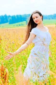 free happy woman in a Russian field