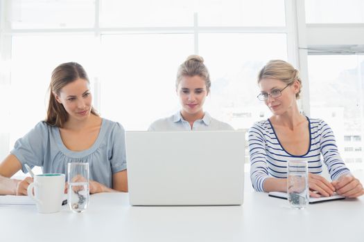Portrait of three people working in office