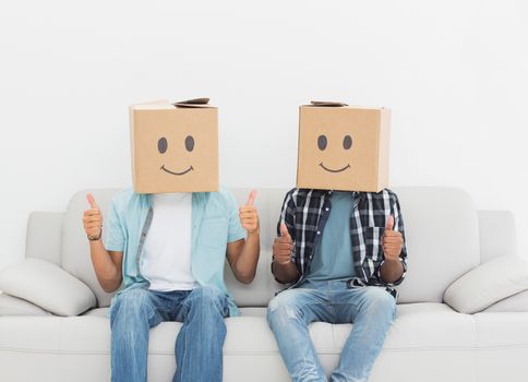 Men with happy smiley boxes over faces gesturing thumbs up